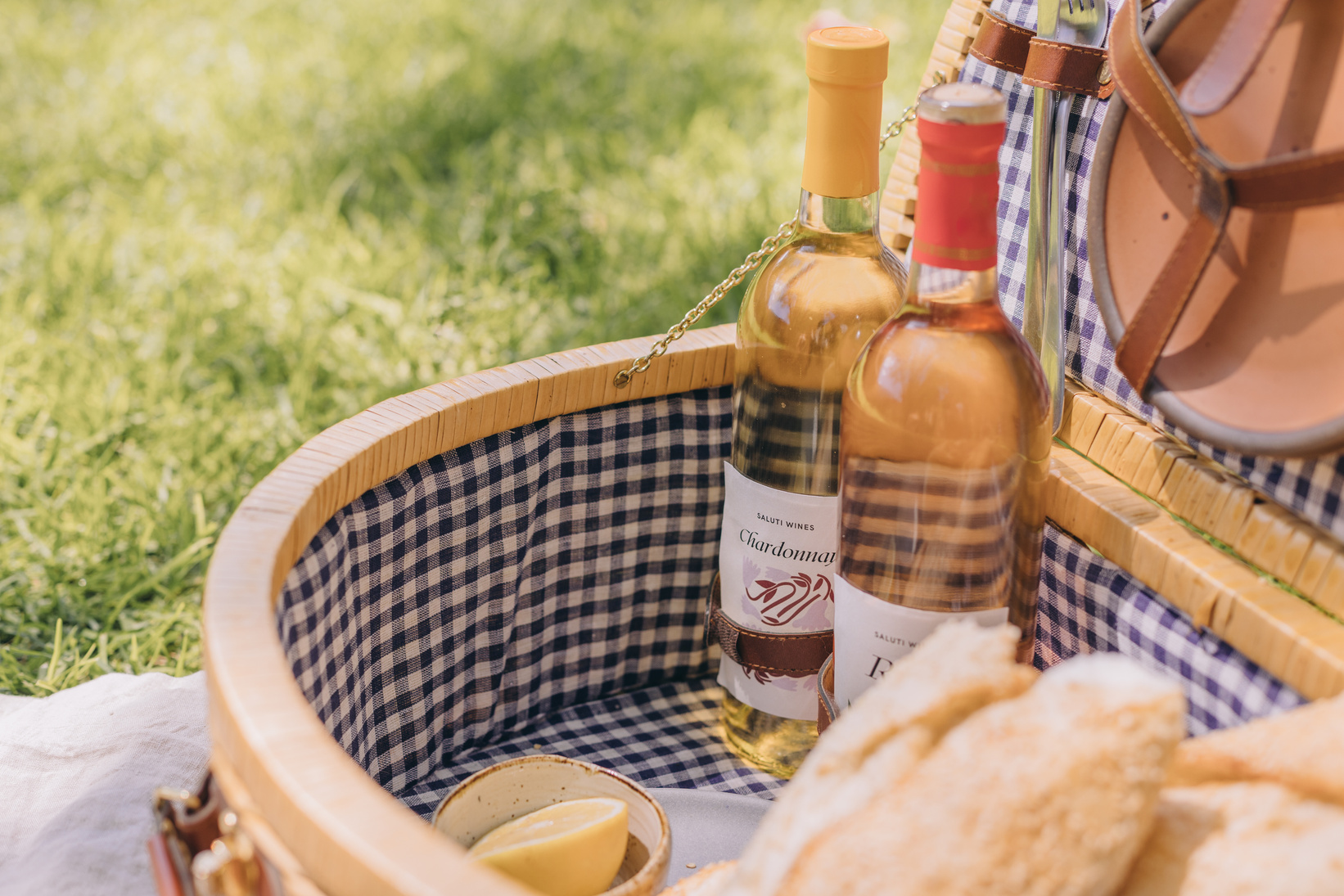 Two Bottles of Wine and Bread in a Picnic Basket